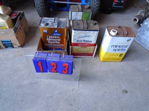Cans of mineral spirits & leather oil. As shown.