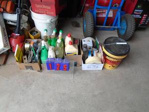 Flat of misc lighter fluidwindow cleaner, etc. As shown.