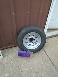 New ST145r12 trailer on 5 hole rim. As shown.