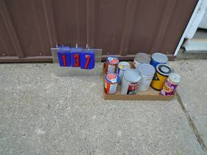 Flat of vintage oil products. One can opened. Others sealed. As shown.