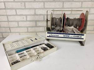 lot 283 image: Vintage Tin Guaranteed Wire & Cable Spark Plug Wire, Boot and Crimper Kit