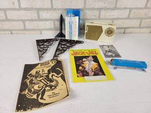 lot 383 image: New Ulm Rain Gauge, 1973 Jack & Jill Circus Program, Kenyan Traditional Dance Book, Cast Iron Shelf Brackets (8 x 6) and More