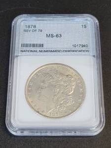 lot 425 image: 1878 Silver Morgan Dollar Reverse of 79 - 90% Silver - Graded MS63 by NNC