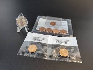 lot 477A image: Lot of Uncirculated US Coins - 2009 Pennies, 1956, 1957, and 1970 Pennies, and 2010 Yellowstone National Park Quarter