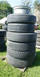 lot 19 image: Stack of misc truck tires for recap or storage trailers