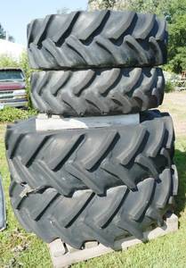 lot 27 image: Two 14.9R24 tractor tires and Two 16.9R34