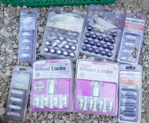 lot 50 image: Multiple Packages of wheel lock nuts and battery cables
