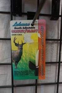 lot 112 image: Lohmans Model 1141 Mouth Adjustable Deer GruntBleat Call With Bowtech Baseball Cap