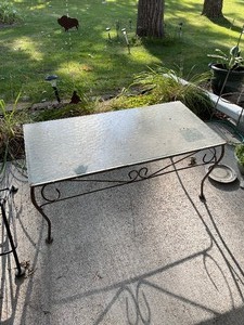lot 190 image: Glass and Black Metal Patio Table