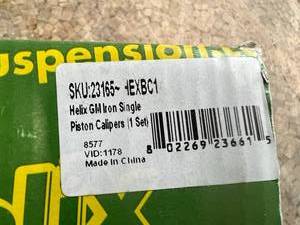lot 53 image: NIB Helix GM Iron Single Piston Calipers (1 Set)