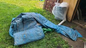 lot 84 image: plastic sheeting and a heap of tarps