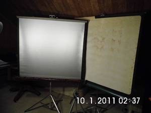 lot 17 image: 2 Vintage retractable projection screens with a single folding tripod