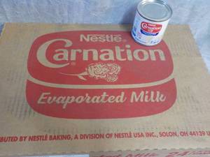 lot 70 image: Tray of 24 - 5 oz Cans Nestle Carna...