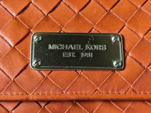 lot 93 image: Michael Kors Leather Clutch