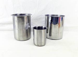 lot 42 image: Lot of 3 Beakers Including Vollrath 78710 Stainless Steel Beaker 1 Small Stainless Steel Beaker and 1 Aluminum Beaker