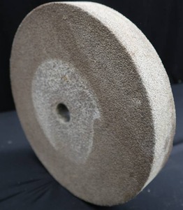 lot 7 image: VINTAGE GRINDING STONE 12 DIAMETER 2 INCHES THICK