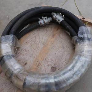 lot 125 image: ROLL OF BLACK TUBING WITH CONNECTORS