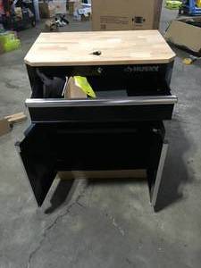 lot 43 image: Husky Ready-to-Assemble 24-Gauge Steel 1-Drawer 2-Door Garage Base Cabinet in Black (28 in. W x 33 in. H x 18 in. D)   Customer Returns See Pictures
