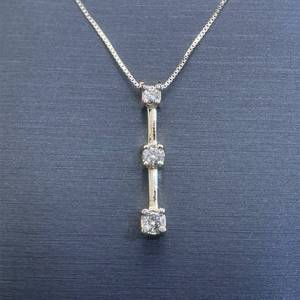 lot 24 image: 0.20 Carat Diamond Three-Stone Past, Present & Future Elongated Bar Pendant in Yellow Gold $1,240 Retail