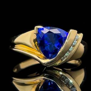 lot 16 image: Trillion Cut Tanzanite & Diamond Modern Channel Asymmetrical Ring in 14k Yellow Gold $2,050 Retail