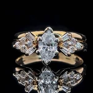 lot 34 image: 1.00 Carat Diamond Marquise, Round Brilliant & Baguette Solitaire Cluster Engagement Ring in 14k Yellow Gold $2,999 Retail