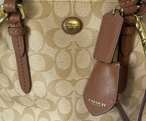 lot 197 image: Coach Peyton Signature Cora Domed Satchel Handbag