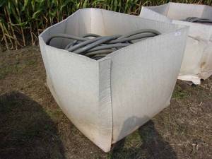 lot 54 image: Crate of 34-inch Garden Hoses