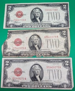 Three 1928 Red Seal Two Dollar Bills