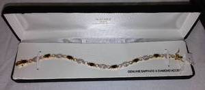 lot 601 image: Sapphire and Diamond Tennis Bracelet.