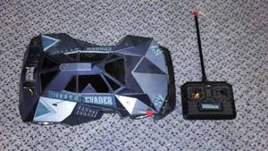 lot 605 image: Remote Evader 57 control car by Radio Shack.