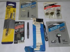 lot 762 image: E-Z outs Router Bits, Drill bit set and more.