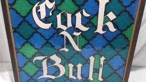 Lighted Cock And Bull Sign.