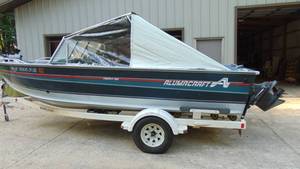 lot 10 image: 1991 Alumacraft 19 Trophy with 4.3L Stern Drive Motor and Shorelander Trailer