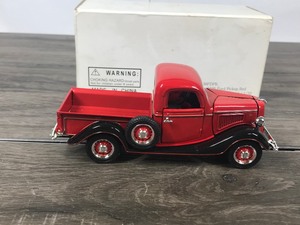 lot 28 image: The National Motor Museum Mint 1936 Ford Pickup Red (Vintage truck of yesteryear) 132 scale die cast