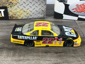 lot 52 image: 1999 Nascar Action Ward Burton Pontiac #22  Caterpillar 124 scale die cast stock car