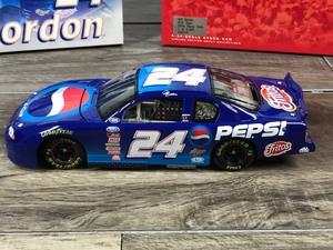 lot 81 image: 2000 Nascar Action RCCA Jeff Gordon Monte Carlo #24  Pepsi 124 scale die cast stock car coin bank