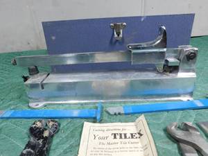 lot 323 image: Vintage tile cutter in original metal case