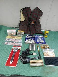 lot 334 image: Ladies Sterns med. life vest,vintage Holidat shell box, 2 bullet band for rifle and shotgun, Compound bow string, advertised canteen and more