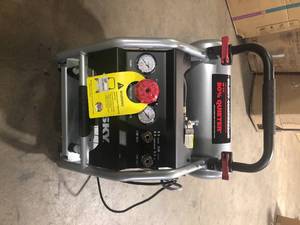 lot 8 image: Husky 4.5 Gal. Portable Electric-Powered Silent Air Compressor    Customer Returns See Pictures