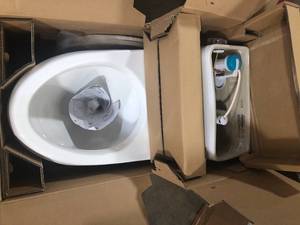 lot 38 image: Glacier Bay Erica 12 in. Rough-In 1-piece 1.28 GPF Single Flush Elongated Toilet in White and Seat Included Customer Returns See Pictures
