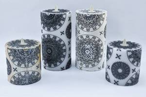 lot 282 image: Four Black Flora Moving Flame Flameless Candles