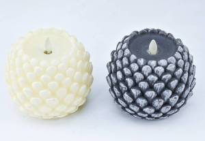 lot 270 image: Pair of Moving Flame Flameless Real Wax Pinecone Candles from Luminara and Liown