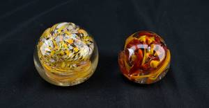 lot 295 image: Two Dynamic Orange and Yellow Paperweights
