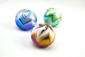 lot 117 image: Three Hand-Blown Pulled Feather Paperweights from Gibson Glass