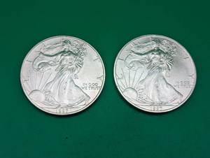 Two 1997 American Eagle Silver Dollars
