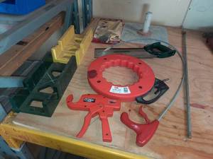 lot 146A image: 100 ft steel tape, Punch Gun, MasterForce Back Saw, Mitre boxes, Saw Guide, Drywall Hawk