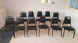 lot 63 image: 11 Black Padded Chairs