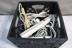 lot 4 image: Crate of Power Surges and 6 foot Extension Cords