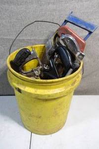 lot 18 image: Bucket of Saws Blades Scissors Scrapers and More