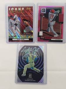 lot 14 image: Lot of 3 Shohei Ohtani Inserts 2022 Panini Donruss No. 141, 2022 Donruss Lights Out LO-6, 2022 Panini Absolute Icons No. I-9